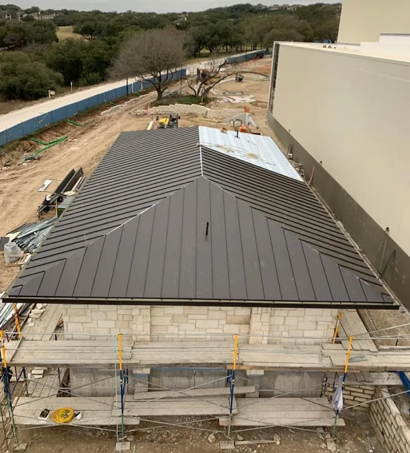 Metal roof new construction with scaffolding in Pasco